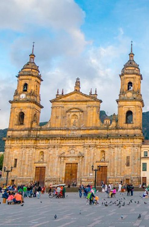 Family groups and walkers along the Plaza de Bolivar in Bogotá